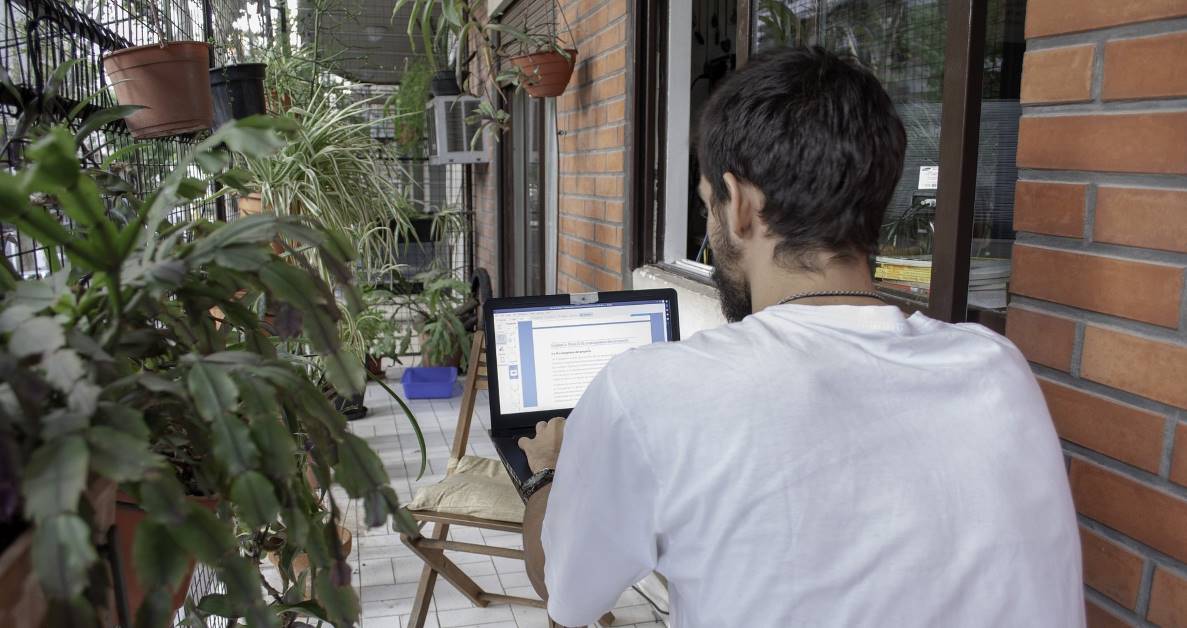 Picture of man using laptop at home